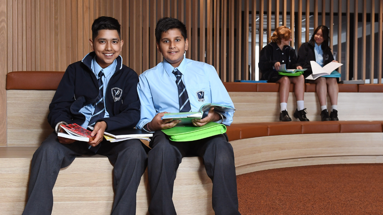 Four students sitting in a school Four students sitting in a school